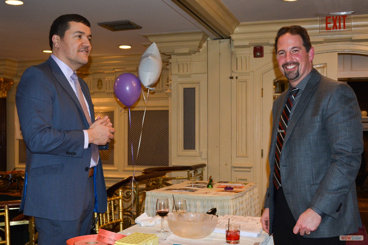 Chapter Treasurer Adriano Duarte (l.) handles chores at the registration table with Chapter Vice-President Sal Zerilli.