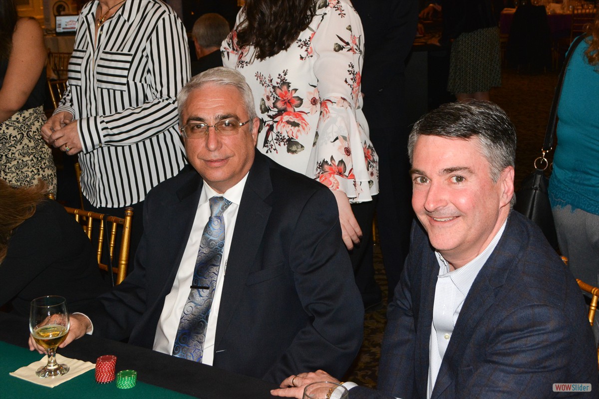 Chapter Past Presidents Fred Viaud and Bob Currie take a time out from a round of poker.