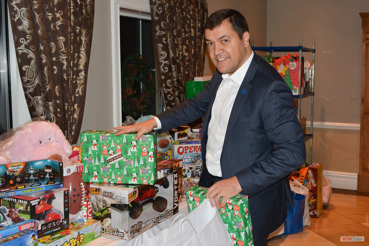 Chapter President Adriano Duarte stacks the gifts donated by Members.
