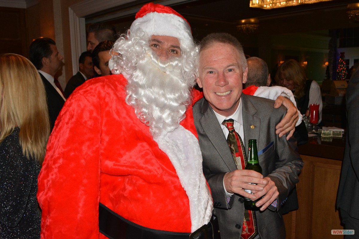 Past Chapter President Brian McCourt gets a photo with Santa