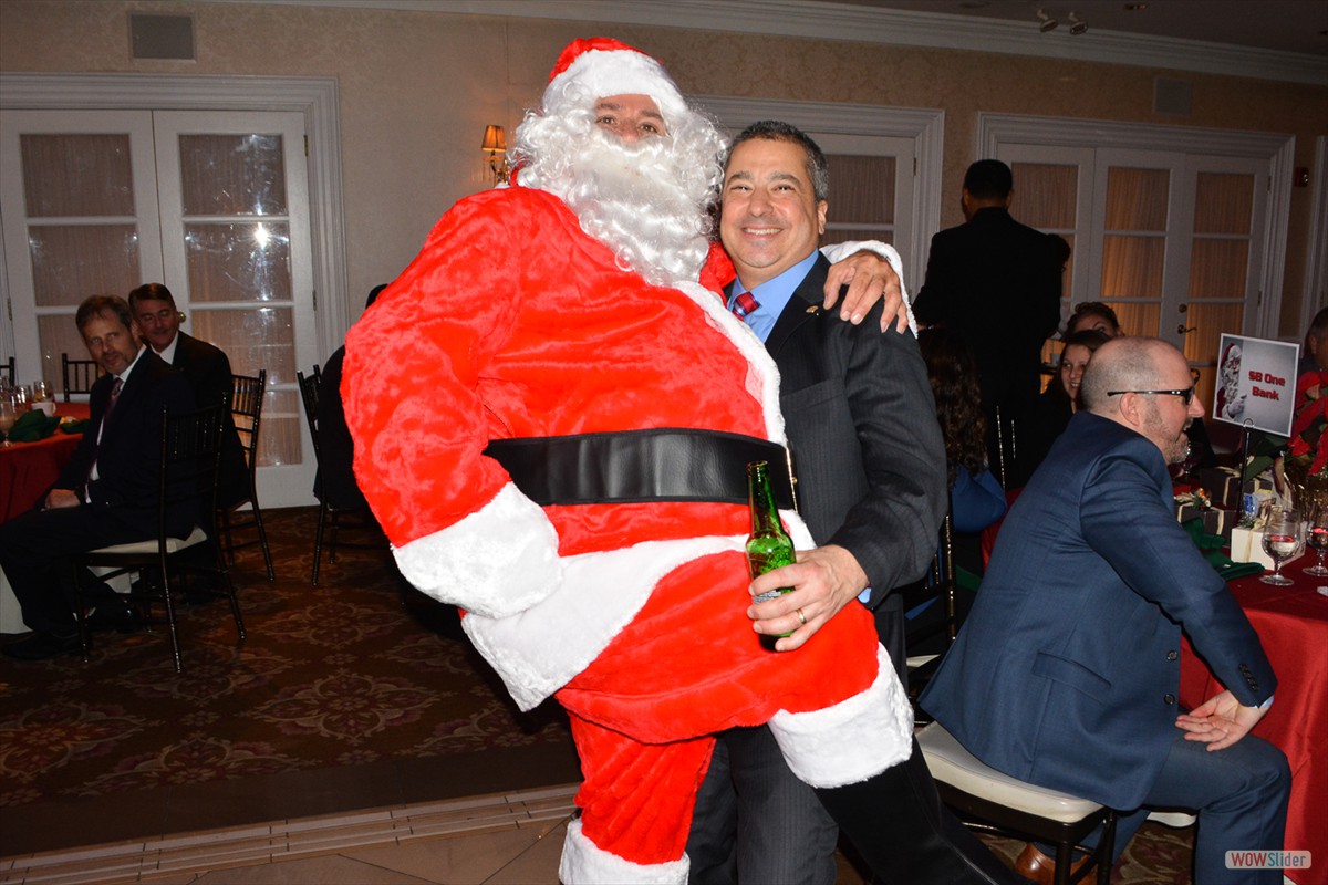 Santa stops for a beer with Past President Steve Fusco