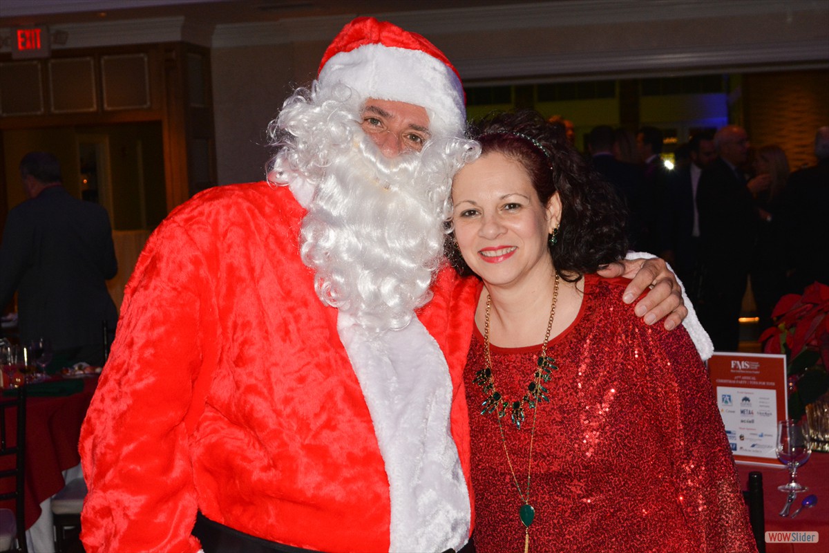 Past Chapter President Grace Cruz Beyer enjoys a special moment with Santa