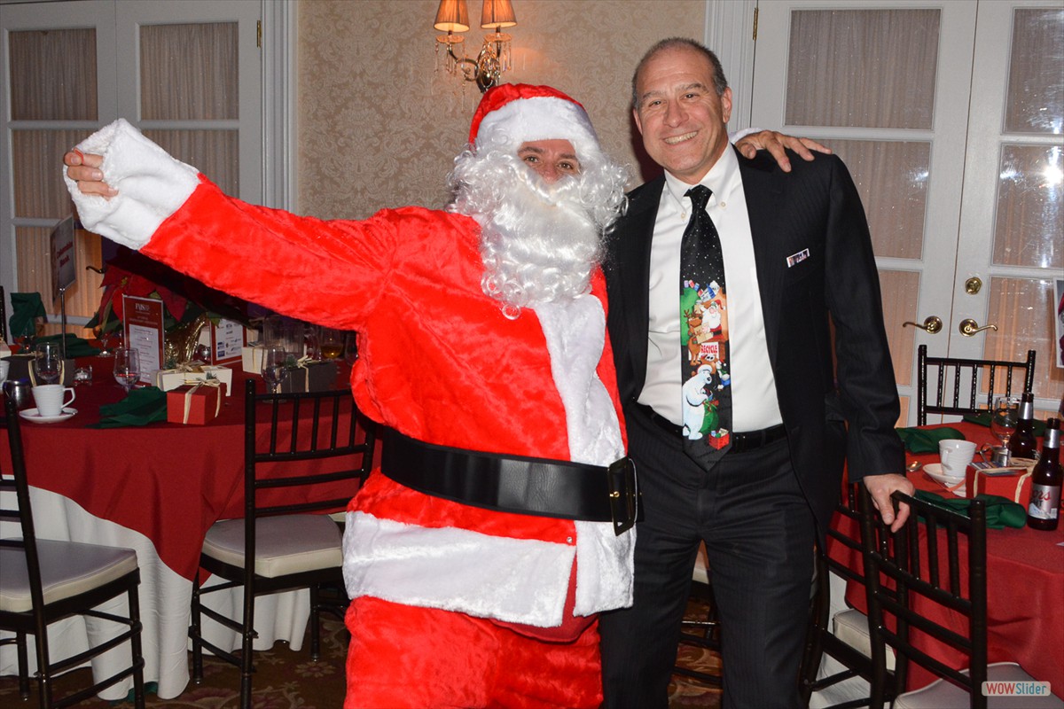 Santa smiles with Past Chapter President Joe Coccaro