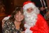Odalys Banks, Director of First Choice, smiles with Santa!
