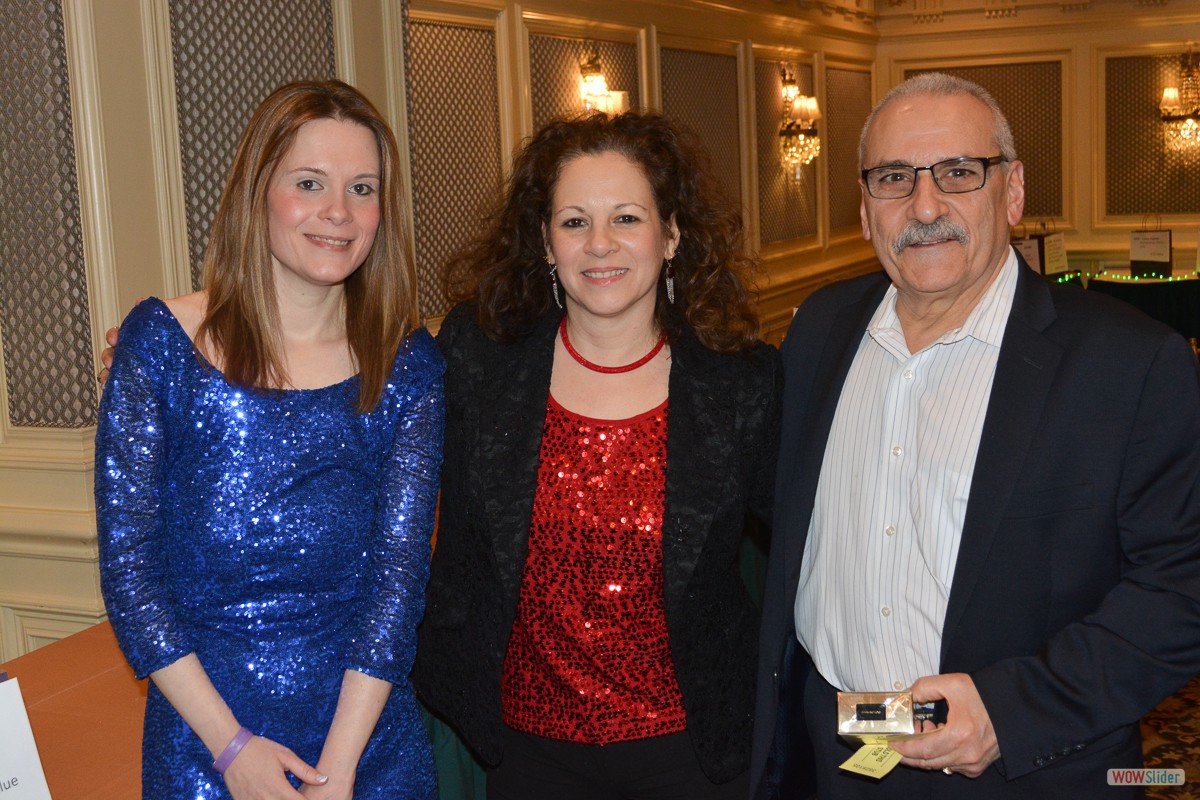 Past Chapter President Nate Buono takes home a prize while posing with Grace and daughter Erica.