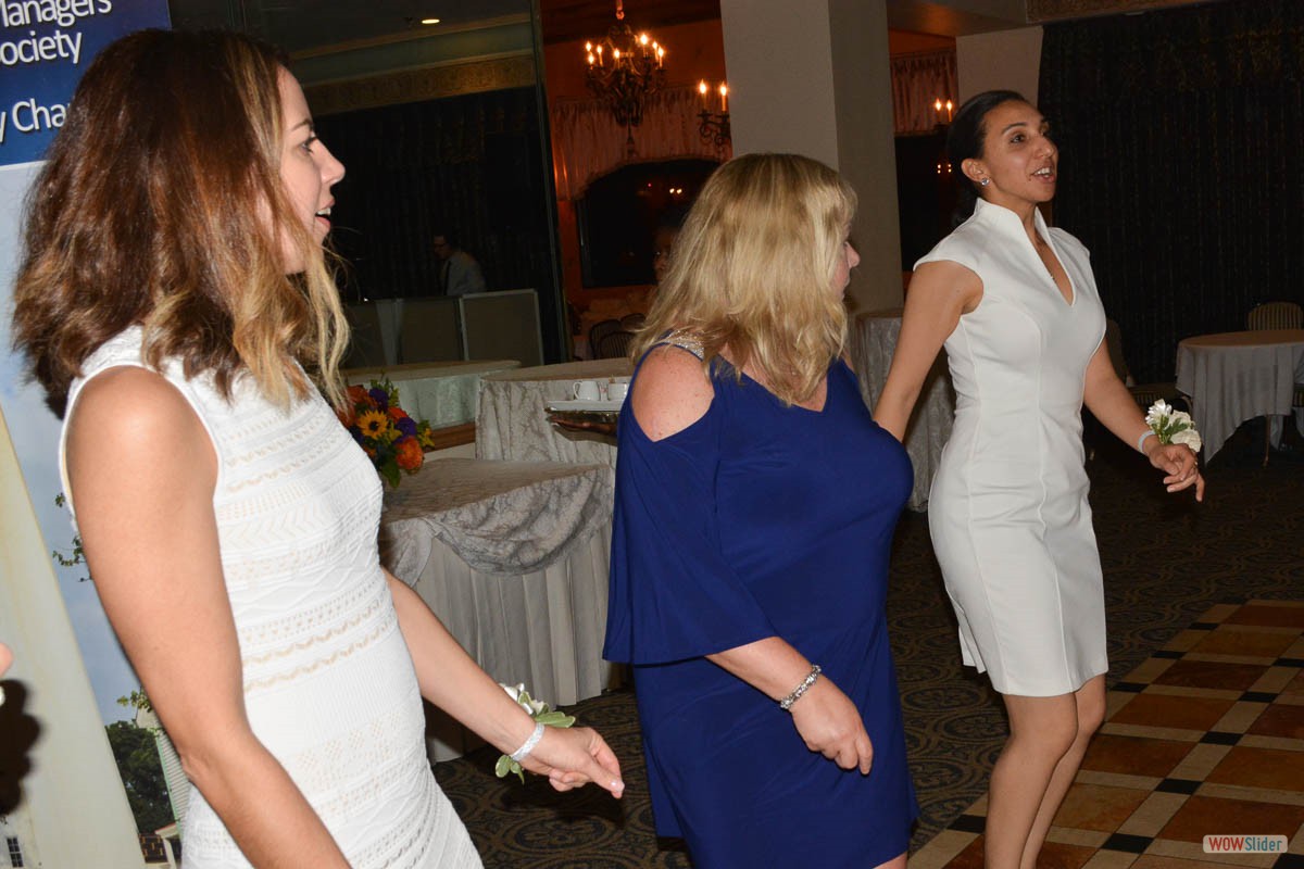 Newly installed Chapter Secretary Suny Mellawa (r.) enjoys the dance floor with Monica and Maureen.