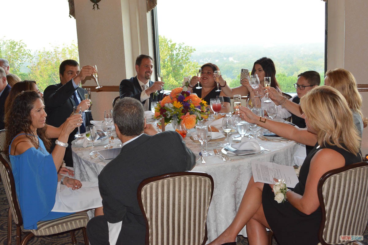 Family members and fellow officers raise a toast to incoming President Salvatore Zerilli (center-left)