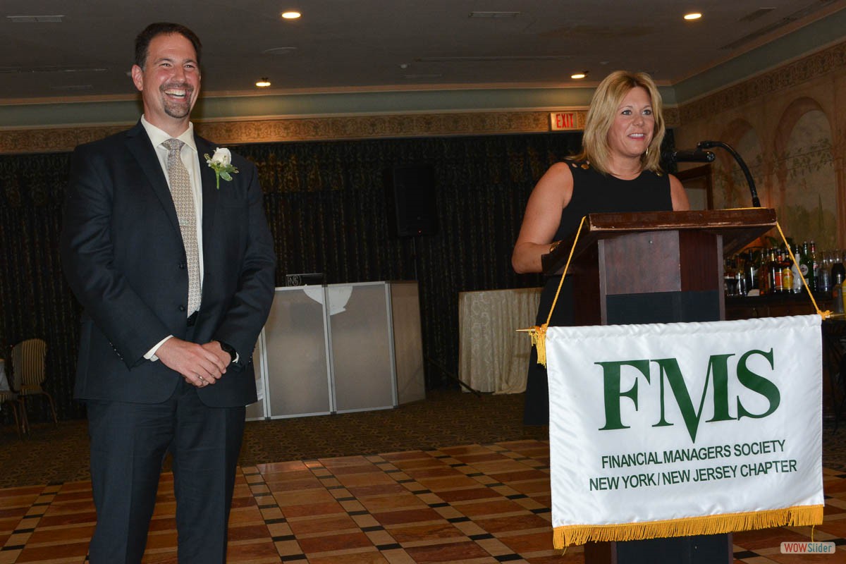 Danielle Holland, FMS National Chapter President, preapres to install Salvatore Zerilli as Chapter President.