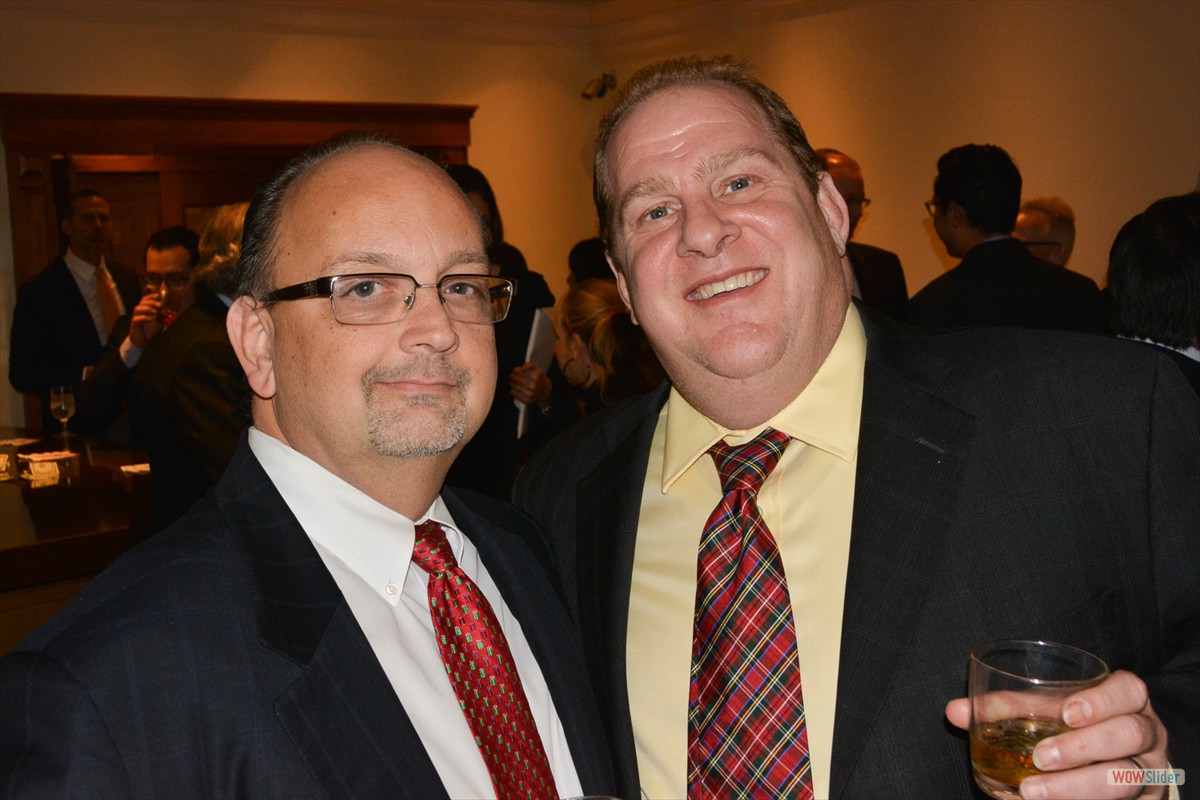 Chapter Past President Al Fontanella (l.) enjoys the cocktail reception with James Redding