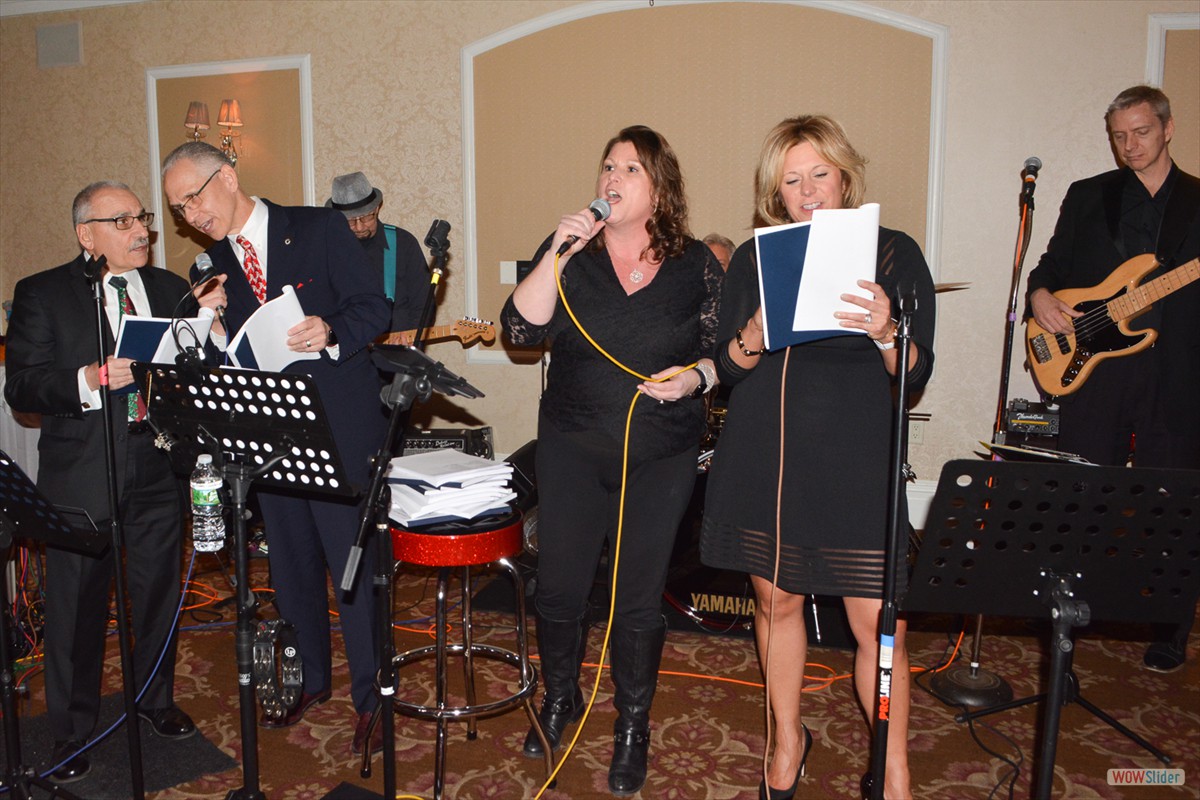 FMS National President Danielle Holland (r.) joins lead singer Cindi Rand for a rendition of 'Bad, Bad Leroy Brown' with backup singers Nate Buono and John Klimowich
