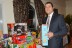 Chapter Vice President, Adriano Duarte piles up the gifts donated by Members for the benefit of Toys-for-Tots.