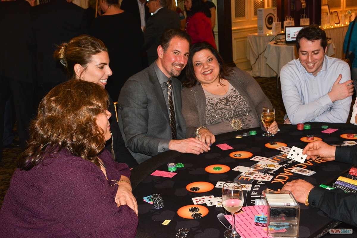 Chapter President Sal Zerilli (c.) and spouse Toni enjoy blackjack with friends.