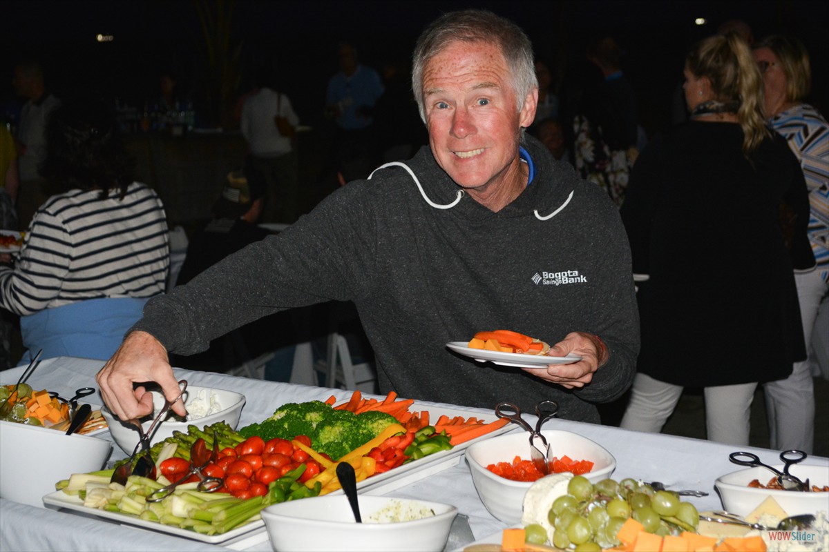 Past President Brian McCourt enjoys a selection from the buffet.