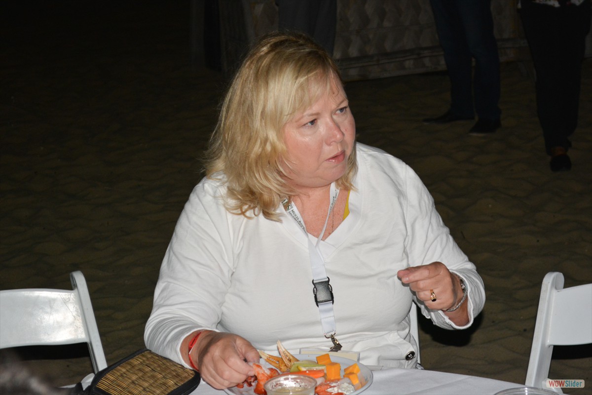 Past Chapter President Maureen Kaleena enjoys fine appetizers at the reception.